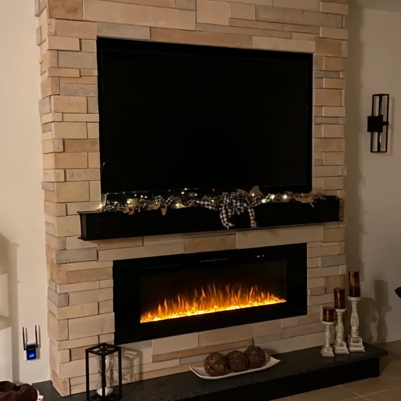 Finished stone fireplace and TV feature wall with electric firebox