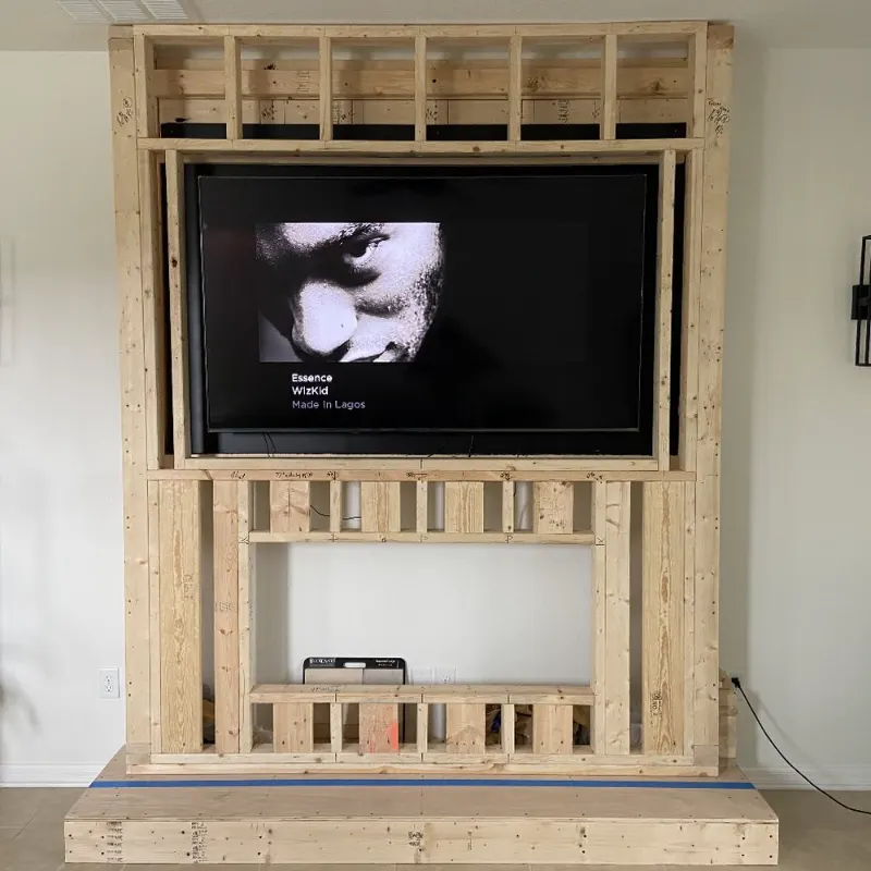 Framing a custom fireplace and TV feature wall