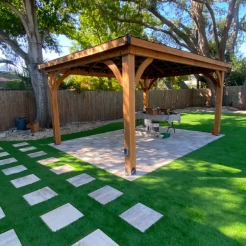 Finished cedar gazebo over a paver patio with turf lawn